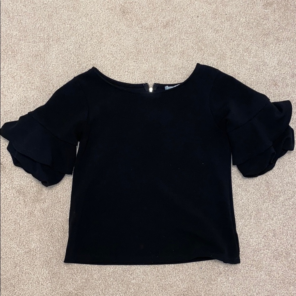 Black shirt with ruffled sleeves